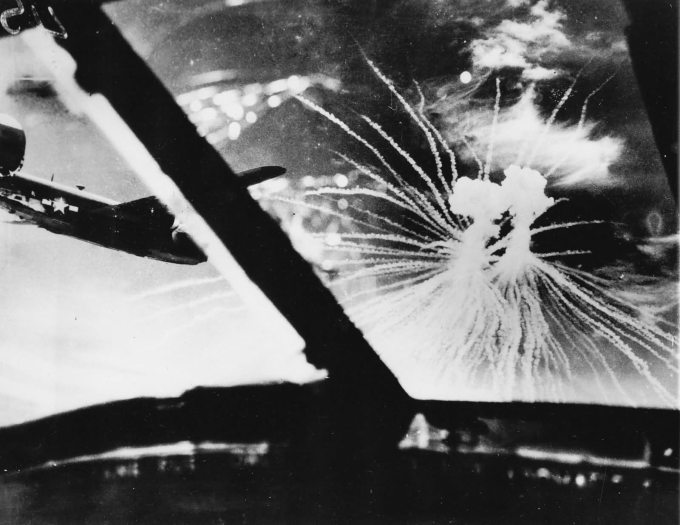 http://www.worldwarphotos.info/wp-content/gallery/usa/aircrafts/b-24/USAAF_B-24_Liberator_over_Japan_struck_down_by_Japanese_Phoshphorus_Bomb.jpg